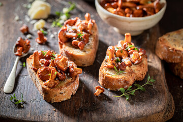 Tasty toasts made of wild mushrooms, herbs and olive. © shaiith