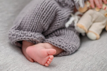 Fototapeta na wymiar Feet of a sleeping baby close-up