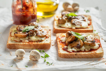 Homemade and delicious toasts made of mushrooms, pepper and cheese.
