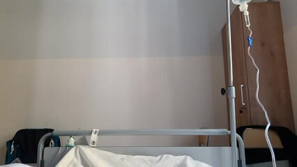 Patient laying in a hospital bed, first person view