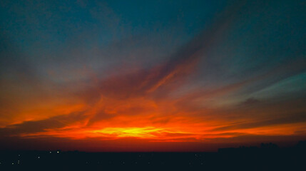 Dramatic weather conditions, beautiful dawn in the city, colorful clouds in sky, nature photography, natural scenery background 