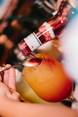 Drink prepared with cherry vermouth and passion fruit