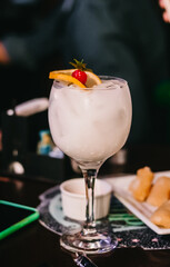 Special cocktail with coconut milk, orange and cereSpecial cocktail with coconut milkSpecial cocktail with coconut milk