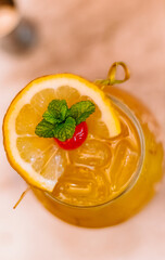 Drink top angle special with orange and cherry and mint