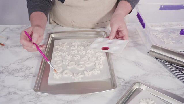 Step by step. Painting fondant snowflakes with food glitter.