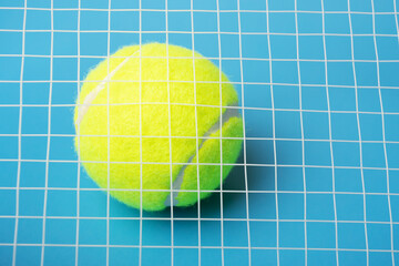 tennis ball behind racket net