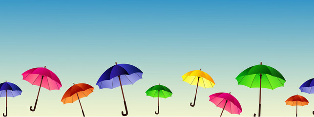 background of sky and colored umbrellas © Valentina
