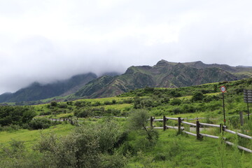 landscape with fence and clouds
