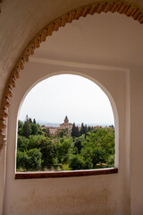 View of the Church of Santa Maria Through a window in Generalife Complex, Granada Spain