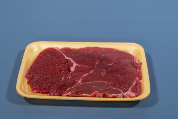red meat beef in yellow foam board