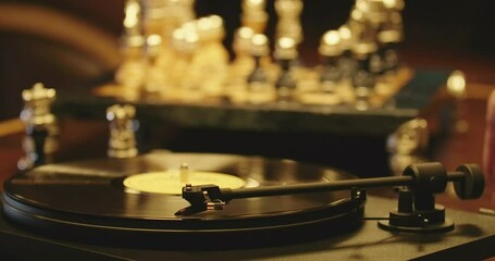 Close-up vinyl disk playing on turntable with male Caucasian hand taking off tone arm needle turning off stereo sound equipment. Unrecognizable man enjoying music indoors. Cinema 4k ProRes HQ