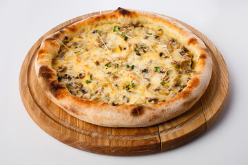 Top view of hot pizza on a wooden stand.