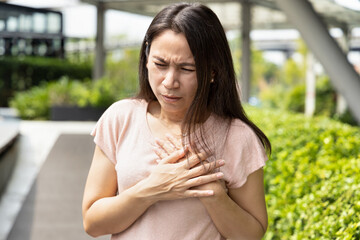 Middle-aged woman having heart attack, acute cardiac arrest