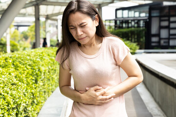 Middle-aged woman suffering from stomachache