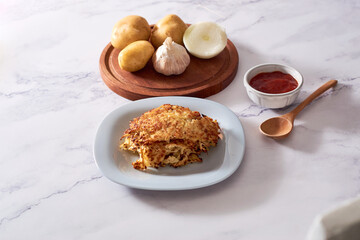 Homemade Hash brown potatoes, toppings on the side.