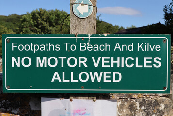 A sign at the start of the footpath to Kilve beach in Somerset, warning that no motor vehicles must pass this point