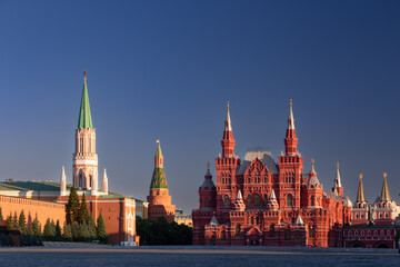 Colorful Red Square panorama with deep shadows against dark blue sky at sunrise, Moscow, Russia