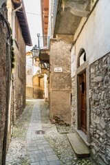 Narrow cobblestone streets with stone houses in the small ancient village Naggio in the province of Como, Lombardy, Italy