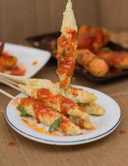 Egg Rolls, Indonesian street food, a combination of beaten egg and rolled noodles. selective focus concept