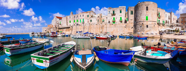 Fototapeta na wymiar Traditional Italy. Atmosferic Puglia region with white villages and colorful fishing boats. Giovinazzo town, Bari province