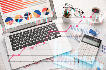Obraz premium Double exposure of virtual screen with business diagrams, modern laptop and calculator on light background