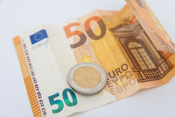 Closeup of euro bills lying on a white background