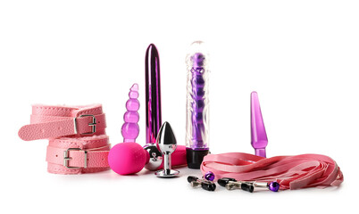 Different toys from sex shop on white background