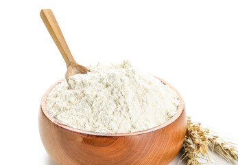 Fototapeta na wymiar Bowl with flour, scoop and wheat ears on white background