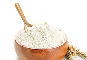 Bowl with flour, scoop and wheat ears on white background