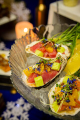 Tuna ceviche in a shell on the festive table