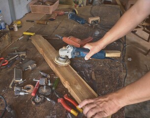 Carpenters, wood polishers, sanders, cutting boards and other equipment. Inside the old room of Asian craftsmen.Professional carpenter in joiner's shop. Concept of woodworking and craftsmanship