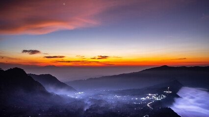 Fototapeta premium Cemoro Lawang village in a misty morning, Mount Bromo, East Java, Indonesia