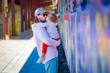 father with her child in love on the railway station in varna bulgaria 
