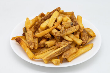 Pile of French Fries with the Skin on a White Plate