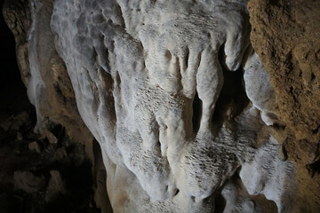 Beautiful stalactites are limestone sediments that form rods or stalactites from the cave ceiling formed by groundwater with dissolved limestone droplets.