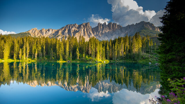 Awesome alpine highlands. Scenic image of fairy-tale Landscape in Dolomites alps. incredible view majestic Dolomite alps with reflection on Lake Karersee, Lago di Carezza.