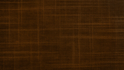 close up dark brown linen canvas fabric texture use as background with blank space for design. bluish distressed linen texture. abstract background.
