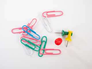 Set of colored paper clips and thumbtacks.