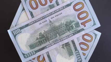 4K Close up American dollar banknotes turning on black background
