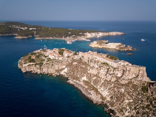 Fototapeta na wymiar Italy, July 2022. Aerial view of the Quakes islands with their Caribbean sea