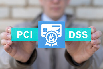 Concept of PCI DSS - Payment Card Industry Data Security Standard. Businessman holding colorful...