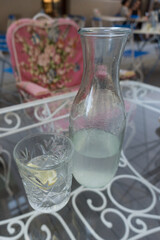 Closeup carafe chilled lemonade table garden chair