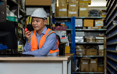 Asian man worker working in warehouse. Industrial and industrial workers concept. worker Man order...