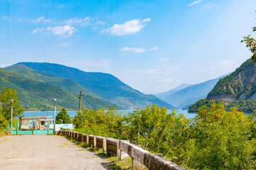 Fototapeta na wymiar reservoir in Georgia medlu mountains greenery and blue sky