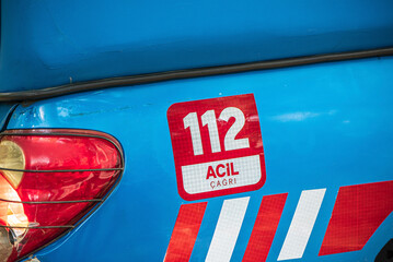 112 emergency call number sign on a gendarme's vehicle in Turkey country.
