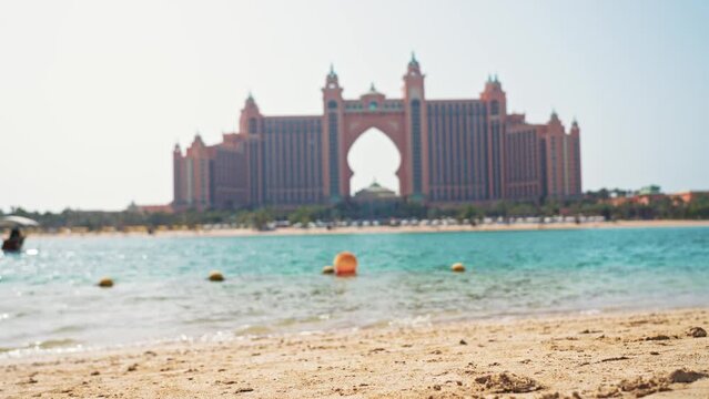 View hotel Atlantis the Palm seen from the Point beach. Atlantis Resort seen across water Dubai, United Arab Emirates.