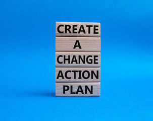 Create a change action plan symbol. Business Concept words Create a change action plan on wooden blocks. Beautiful blue background. Business and Create a change action plan concept. Copy space