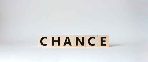 Chance symbol. Concept word Chance on wooden cubes. Beautiful white background. Business and Chance concept. Copy space.