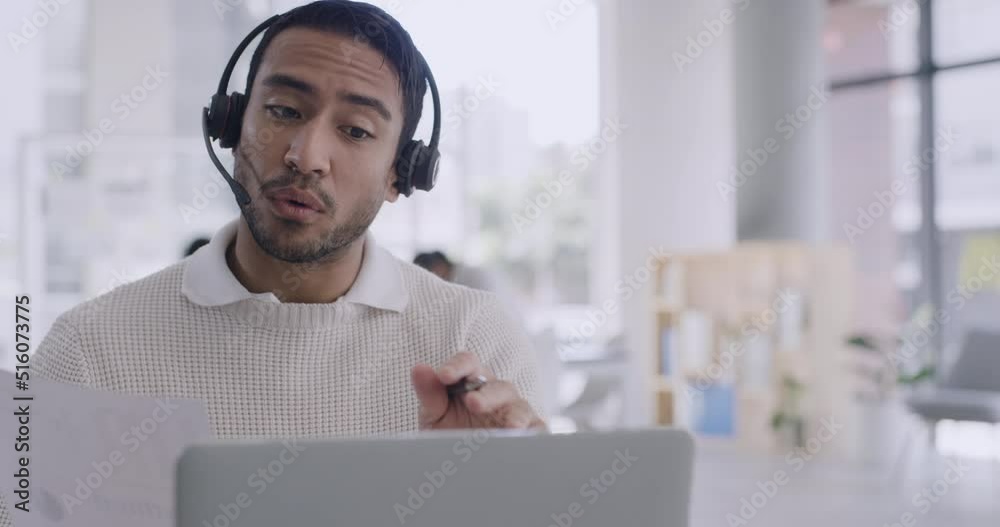 Poster confident businessman using a laptop and headset on a conference call in a modern office. young prof