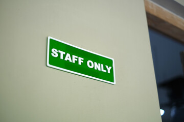 Staff only sign on the wall